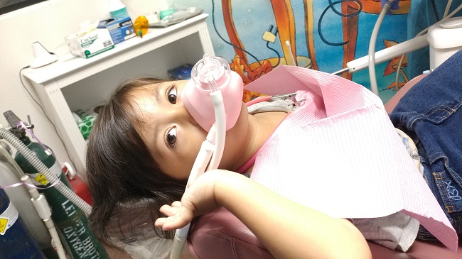 Picture of patient wearing laughing gas mask